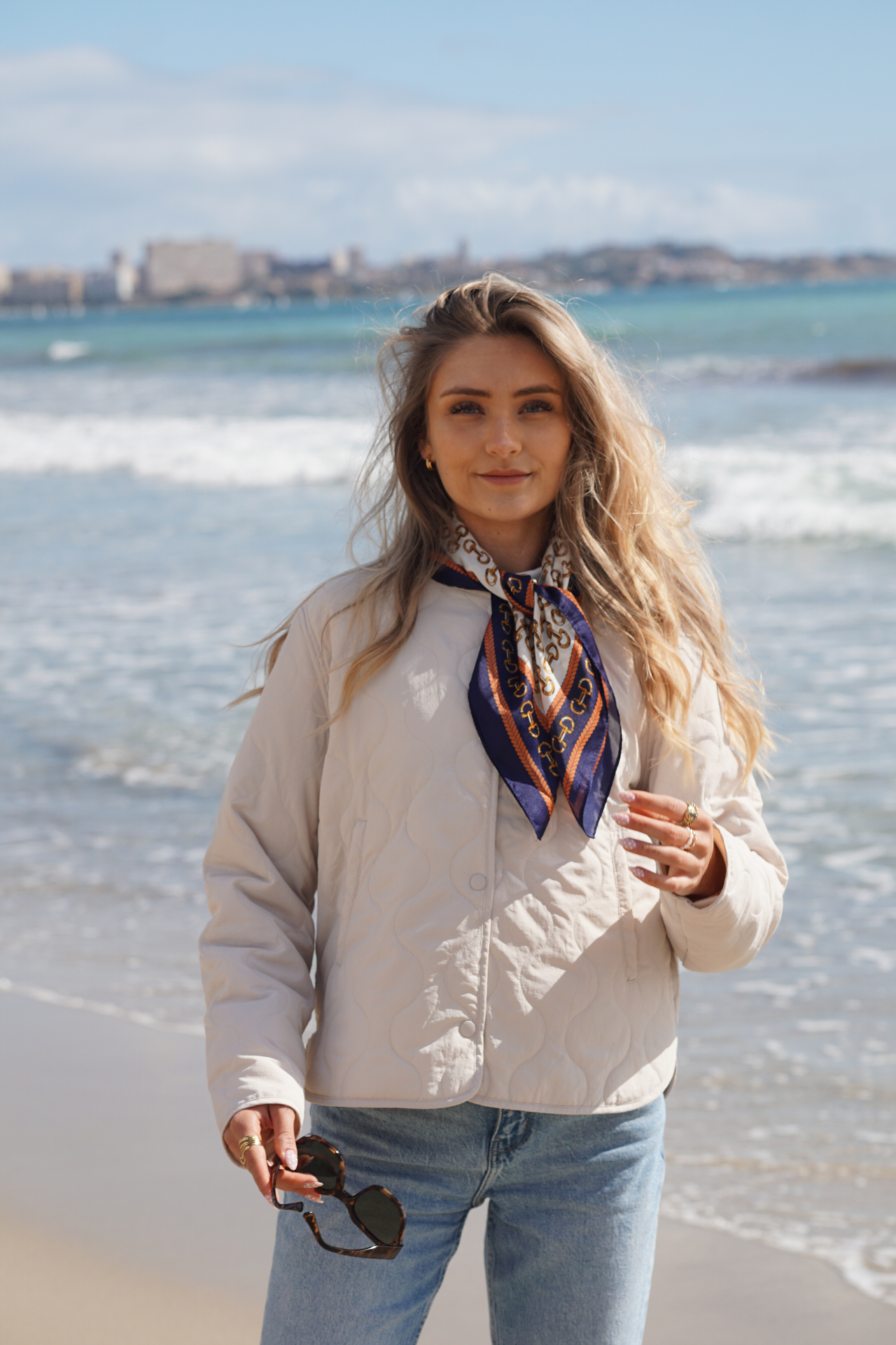 Alina on the beach with a silk scarf